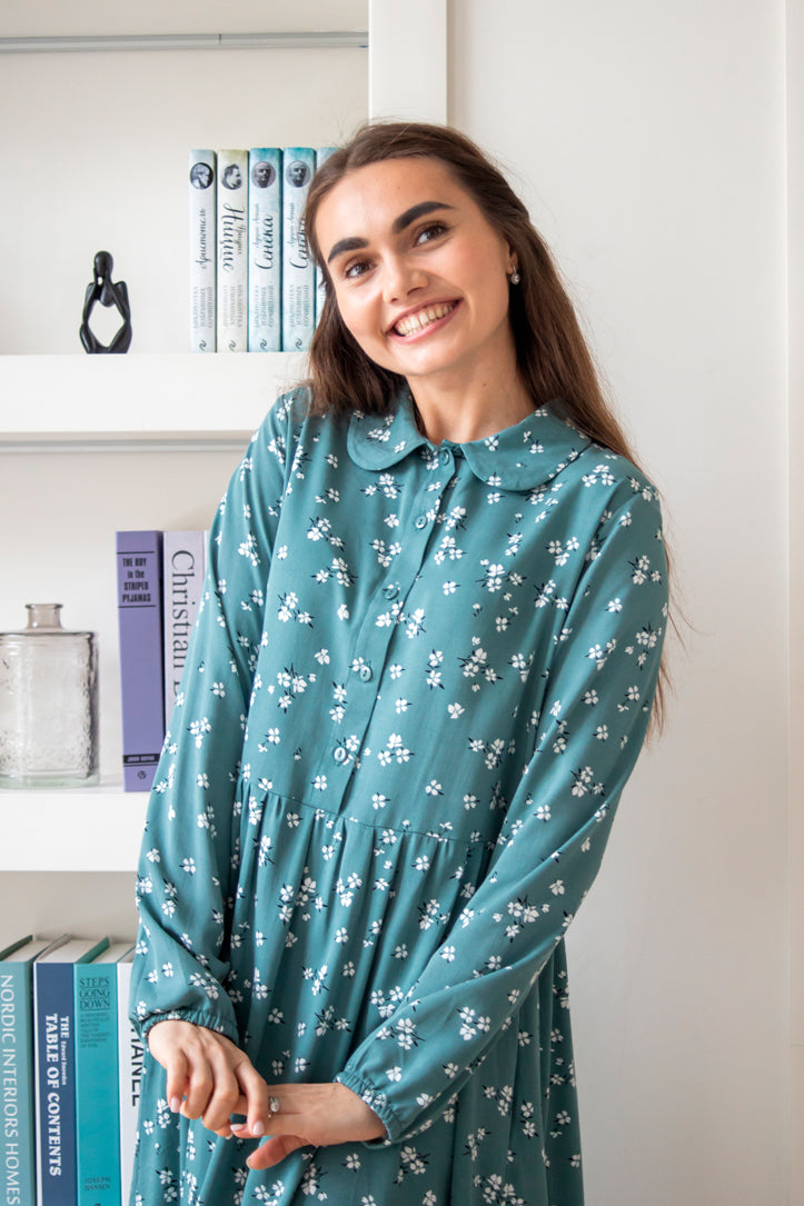 Sophie is a green viscose dress with a round collar